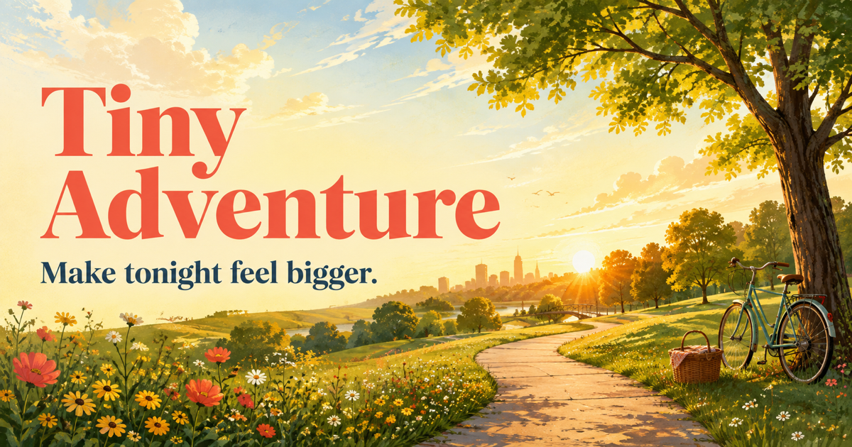 A sunny park path leading toward a city, with flowers, a bicycle, and a picnic basket